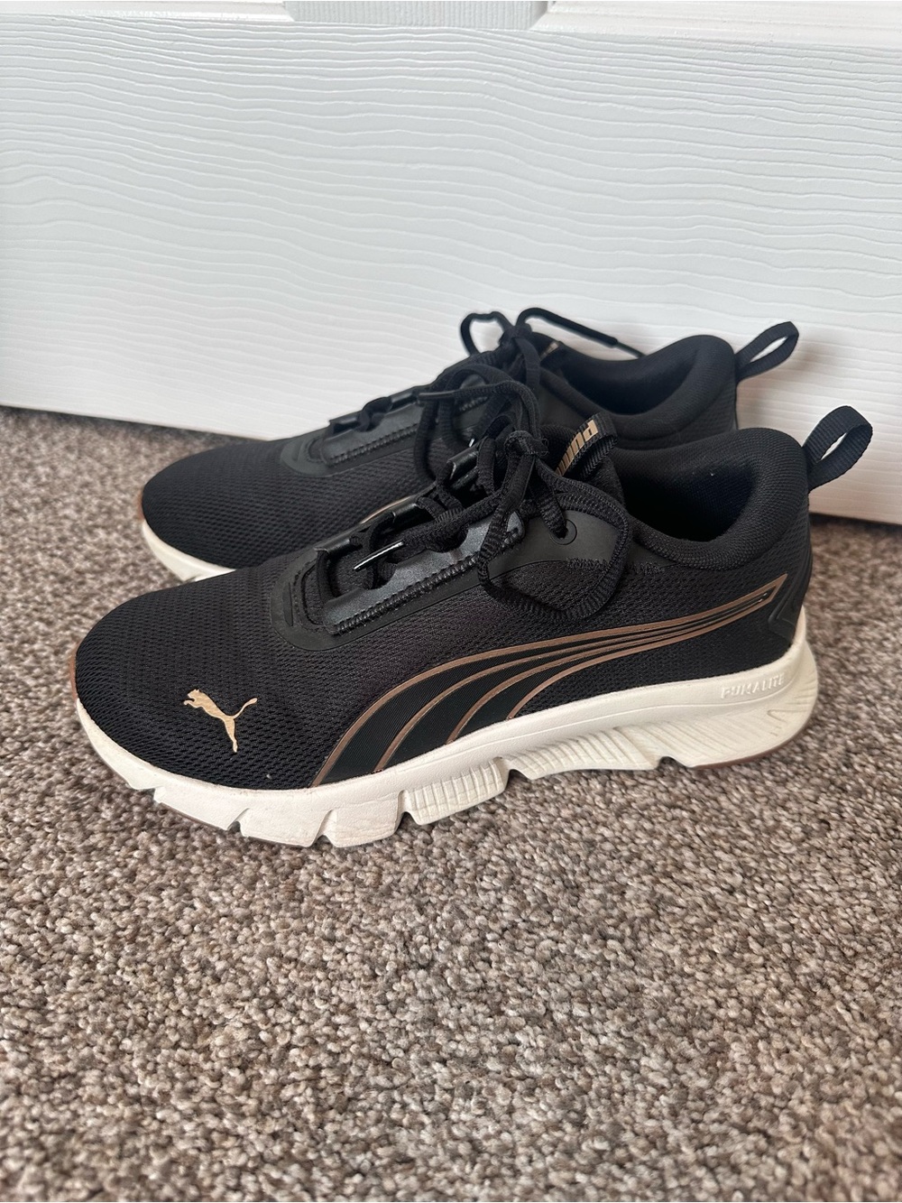 Puma Black Sneakers with Gold Accent Stripe